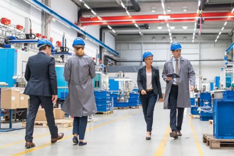 Quality inspector conducting a supplier audit at a manufacturing facility to verify production standards and product quality.
